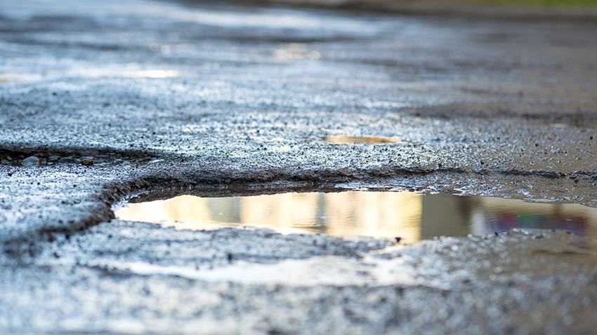 Close-up of a pothole in the road