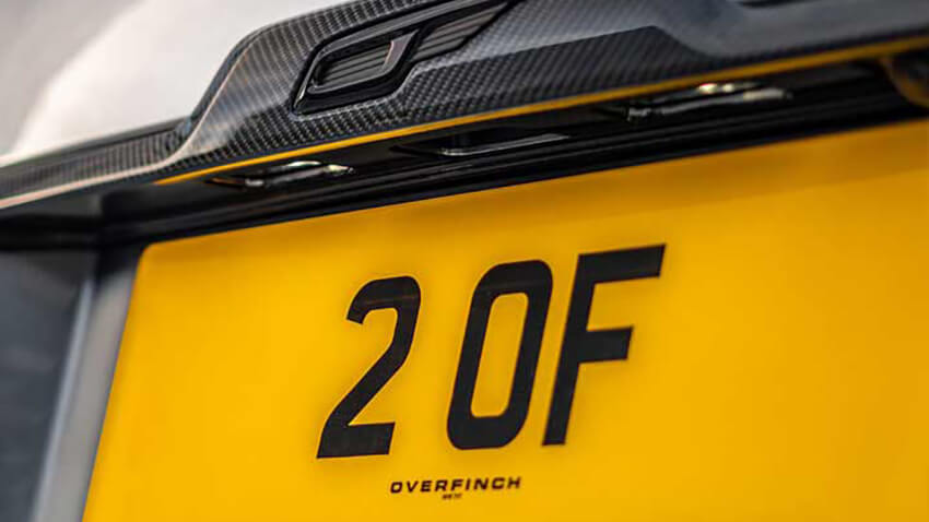 A close-up of one of several private number plates used to promote the business