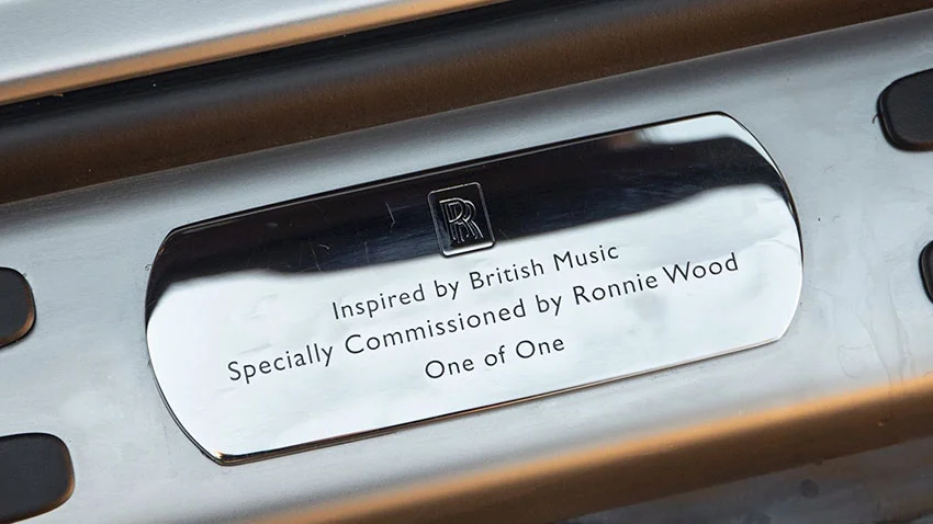 Rolls-Royce plaque with RR logo. Text: Inspired by British Music, Specially Commissioned by Ronnie Wood, One of One.