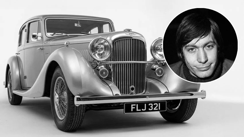 Black and white image of a classic car featuring the UK private number plate FLJ 321, with Charlie Watts' portrait.