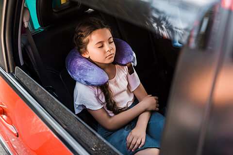 A child wearing a neck rest