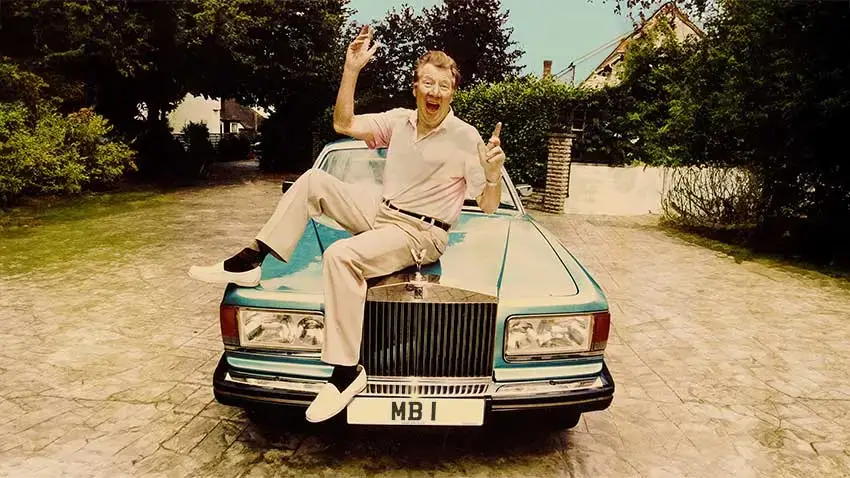 Max Bygraves standing next to a Rolls-Royce with MB 1 number plate