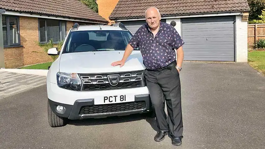 Peter Colin Tibbs with his car bearing registration PCT 81