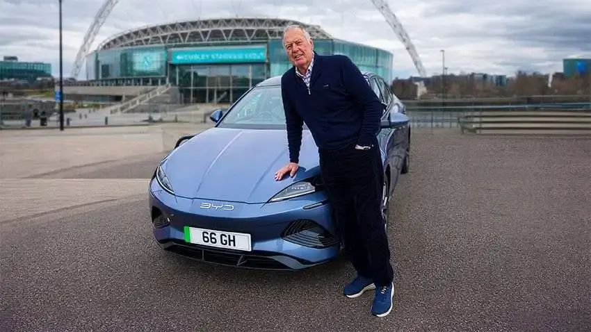Sir Geoff Hurst with his registration 66 GH in front of Wembley Stadium